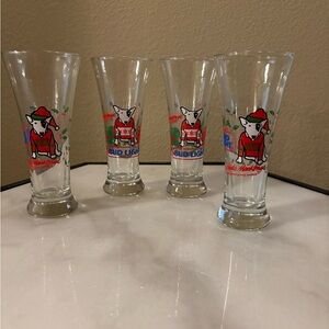 This is a vintage Bud Light pilsner glass featuring Spuds MacKenzie, Set of 4
